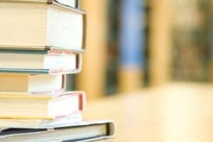 Image shows a stack of books.