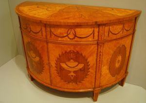 Image shows a Chippendale commode.