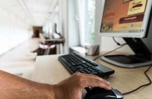 Image shows someone using a computer.