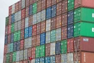 Image shows rows and rows of shipping containers.