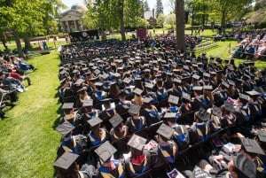 Image shows a group of graduates.