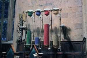 Image shows the House Points counter at Hogwarts, with beads in red, blue, green and yellow representing the scores of the different Houses, from the set of the Harry Potter films.
