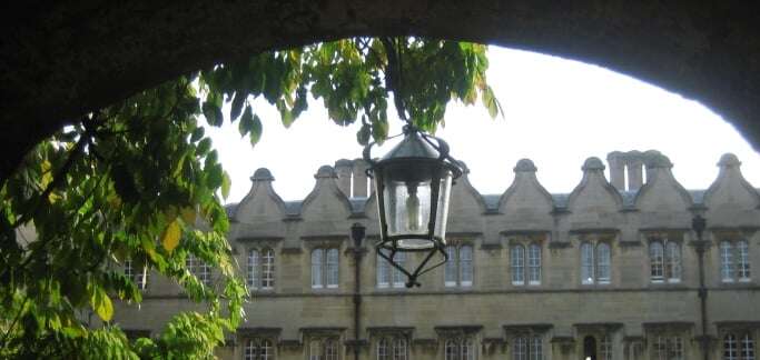 Image shows a view through an archway in Jesus College, Oxford.