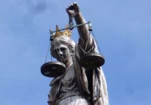 Image shows a statue of Lady Justice.