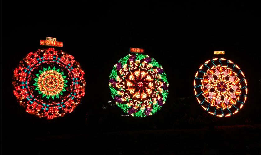 Image shows three brightly-coloured lanterns.