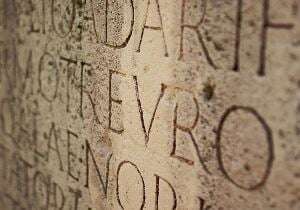 Image shows a Latin engraving. 