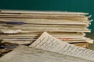 Image shows a pile of handwritten letters.