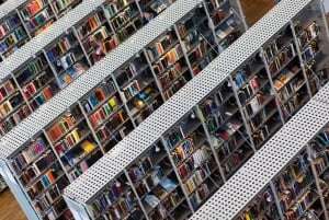 Image shows rows of library shelves.