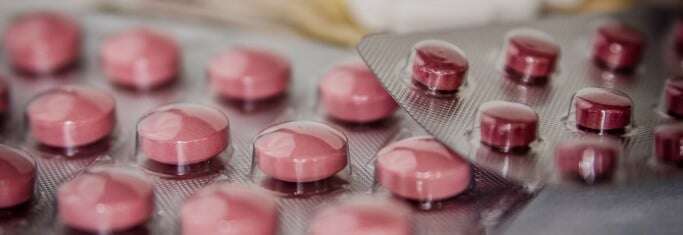 Image shows packets of pills.