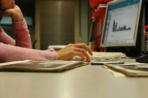 Image shows someone looking at a graph on a computer.
