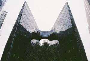 Image shows a towering skyscraper.