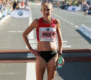 Image shows Paula Radcliffe at the finishing line of the Berlin marathon.