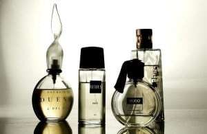 Image shows a row of perfume bottles.