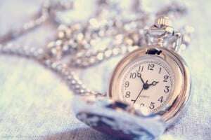 Image shows an open pocket watch.