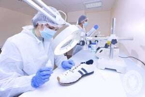 Image shows a forensic scientist working for the police.