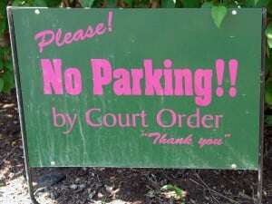 Image shows a sign with far too much punctuation, including "No parking!!"