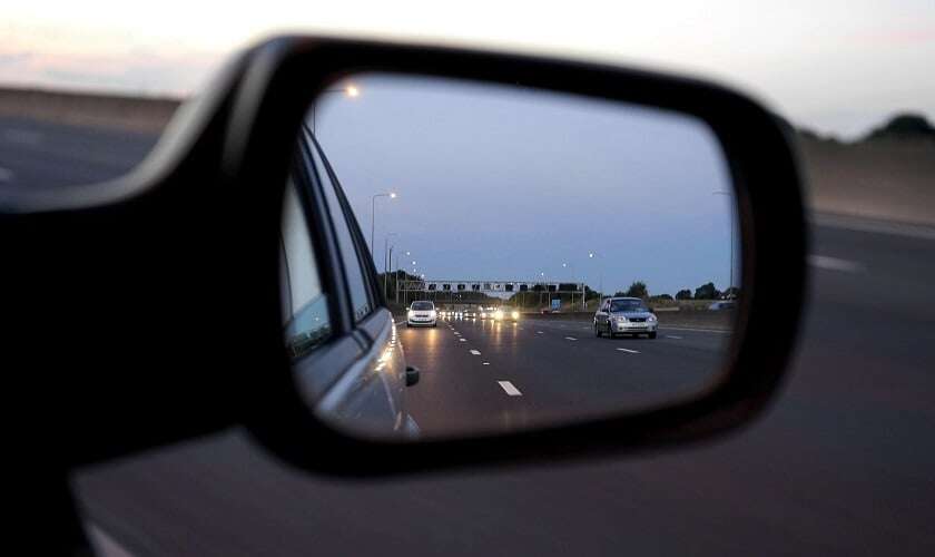 Image shows a car rear view mirror.
