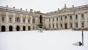 Image shows the Senate House in Cambridge under a layer of snow. 