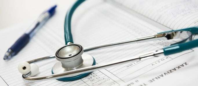 Image shows a pen and a stethoscope.
