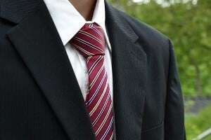 Image shows someone in a suit.