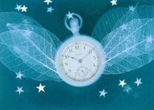Image shows a pocket watch with leaf-veined wings, surrounded by stars. Everything is a dreamlike blue.