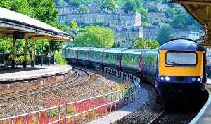 Image shows a train pulling in to a station,