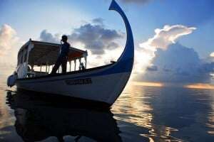 Image shows a boat on a sea.