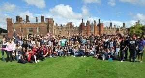 Image shows ORA students waving in front of a castle.