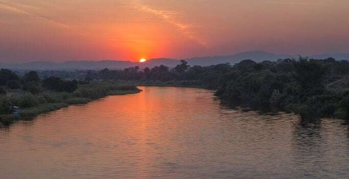 Image shows a sunset in Zambia.