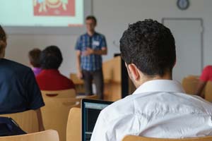 Boy sitting facing front of classroom