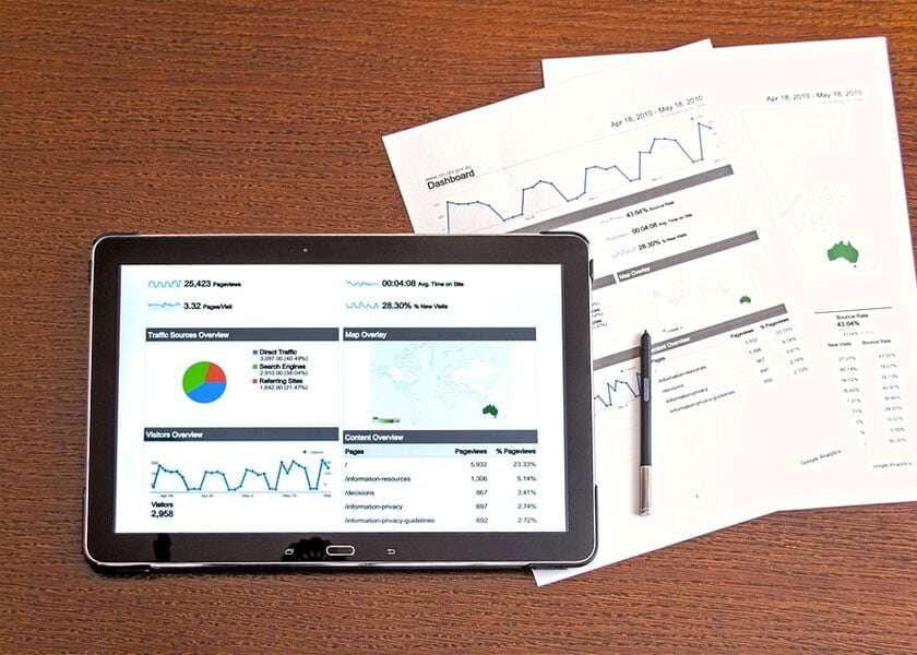 Report displayed on a tablet and paper