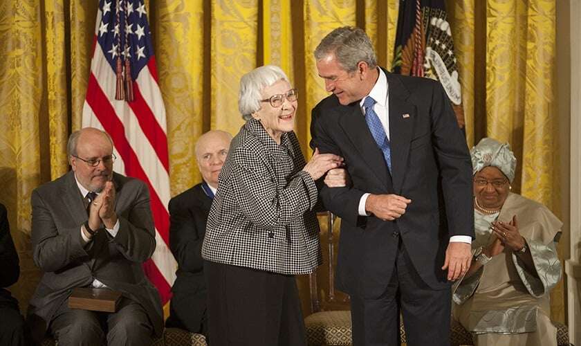 Image shows Harper Lee with President George W Bush. 